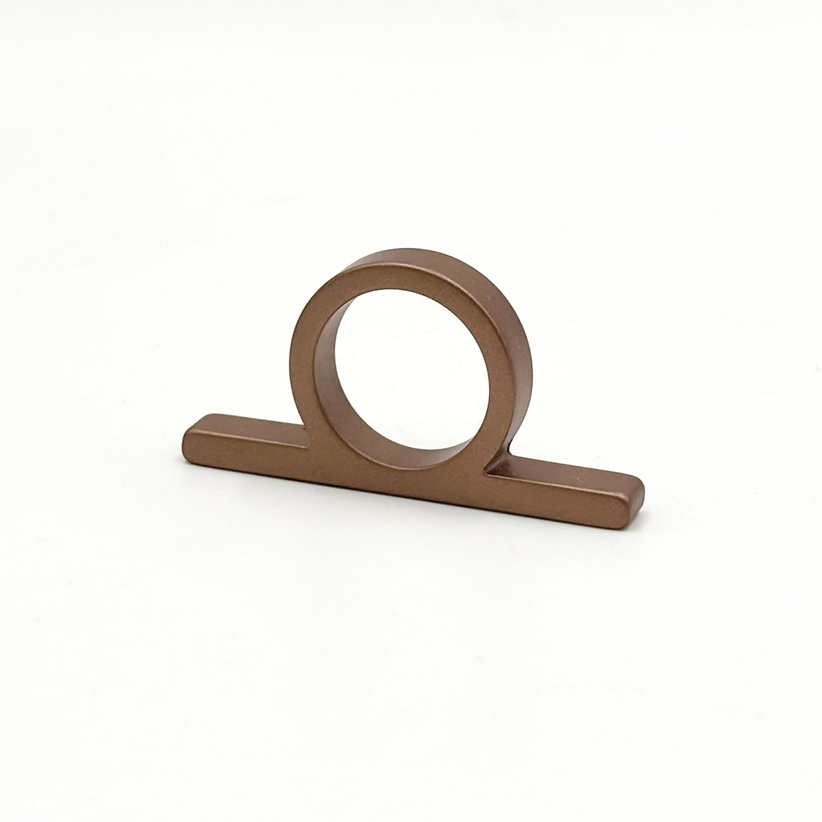 A copper bronze metal ring pull with a circular loop and flat rectangular base, shown on a plain white background.