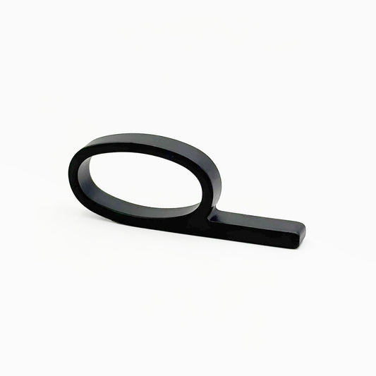 A matte black metal ring pull with a minimalist oval loop and straight bar, shown on a clean white background.