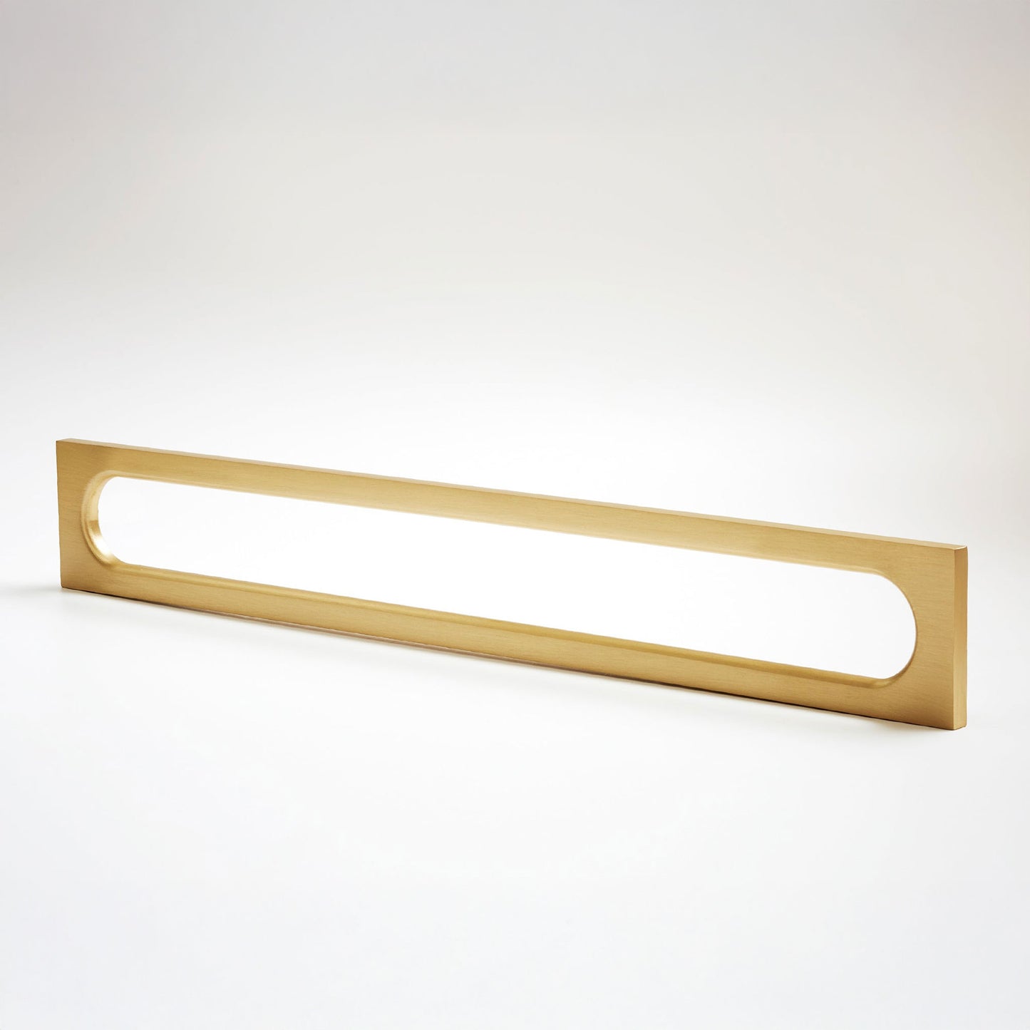 A long, narrow rectangular metak cabinet pull with a rounded rectangular cutout in the center, photographed on a clean light gray studio background.