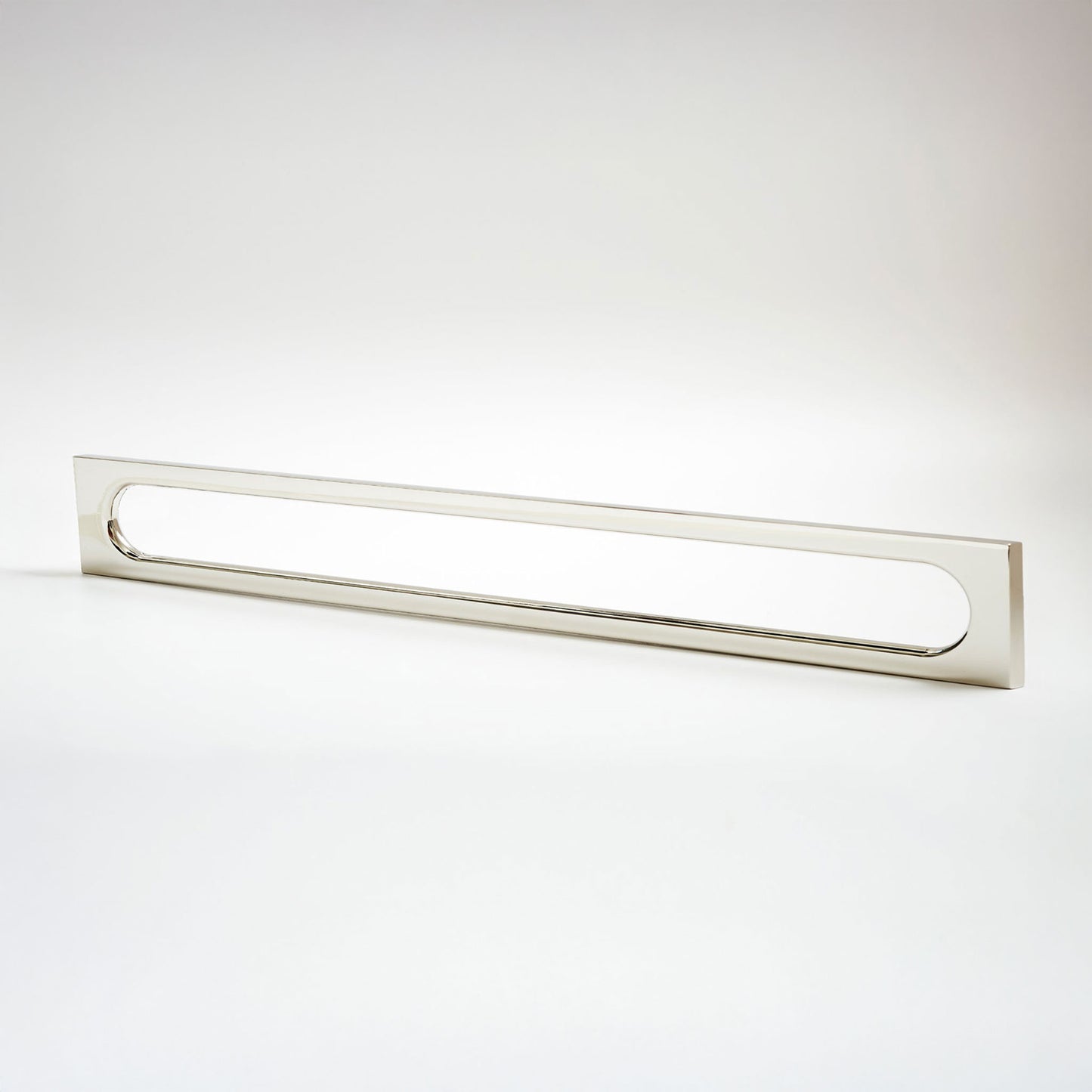 A long, narrow rectangular cabinet pull with a slim metallic frame and an elongated oval panel, shown on a clean white studio background.