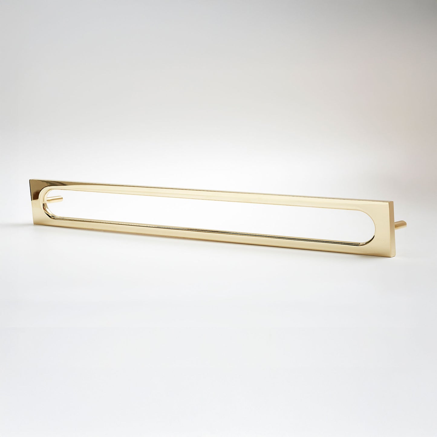 A modern rectangular cabinet pull with a polished gold finish, featuring a sleek open center design, shown against a clean white background.