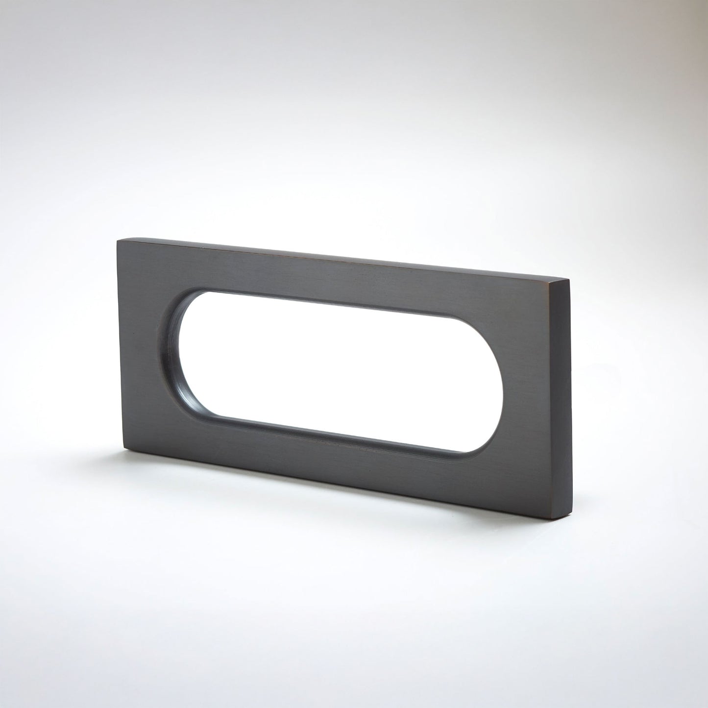 Rectangular black metal handle on a white background