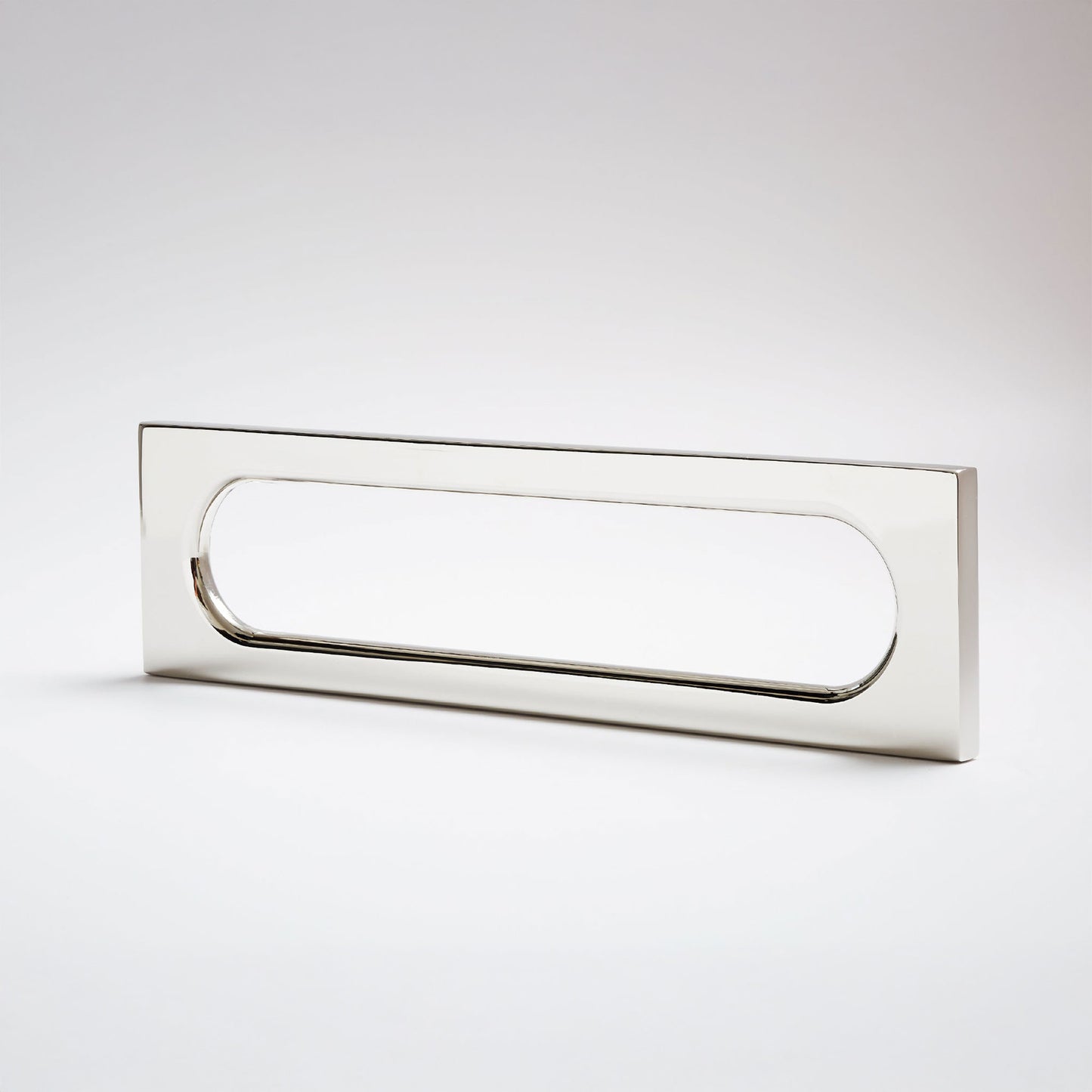 A modern rectangular pull handle with a polished chrome finish, featuring a rounded rectangular cutout in the center, shown on a light gray background.