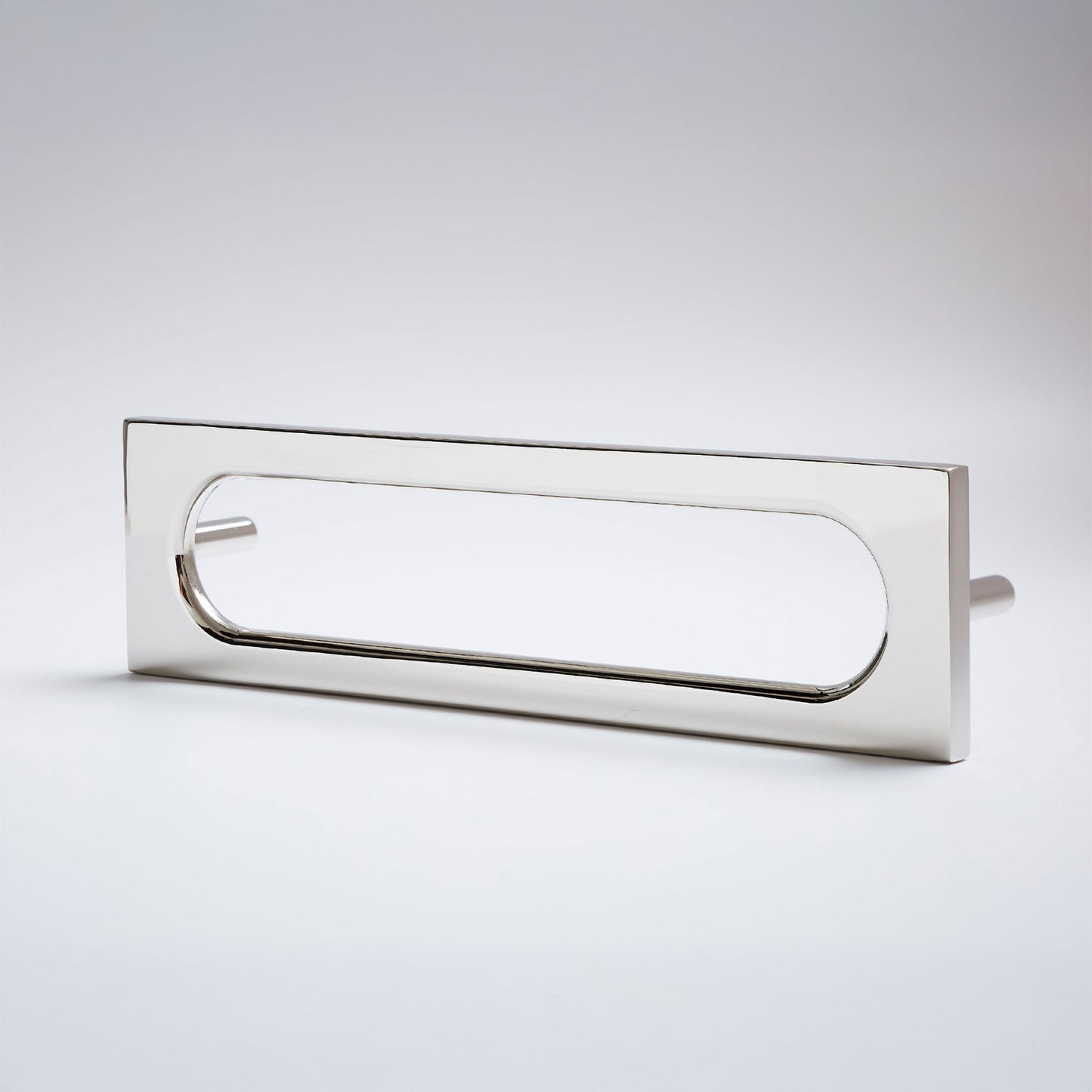 A modern rectangular pull handle with a polished silver finish, featuring a rounded rectangular cutout and a small side lever, shown on a light gray background.