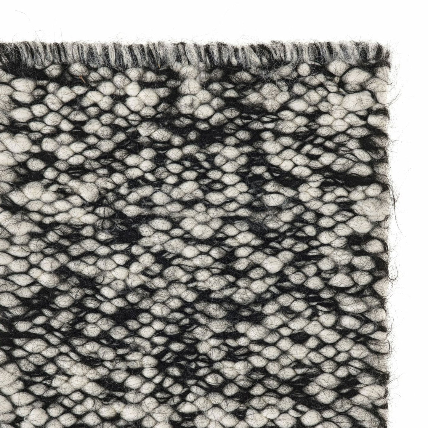 Neve rug style in cream and black colored mottled heavy flat weave