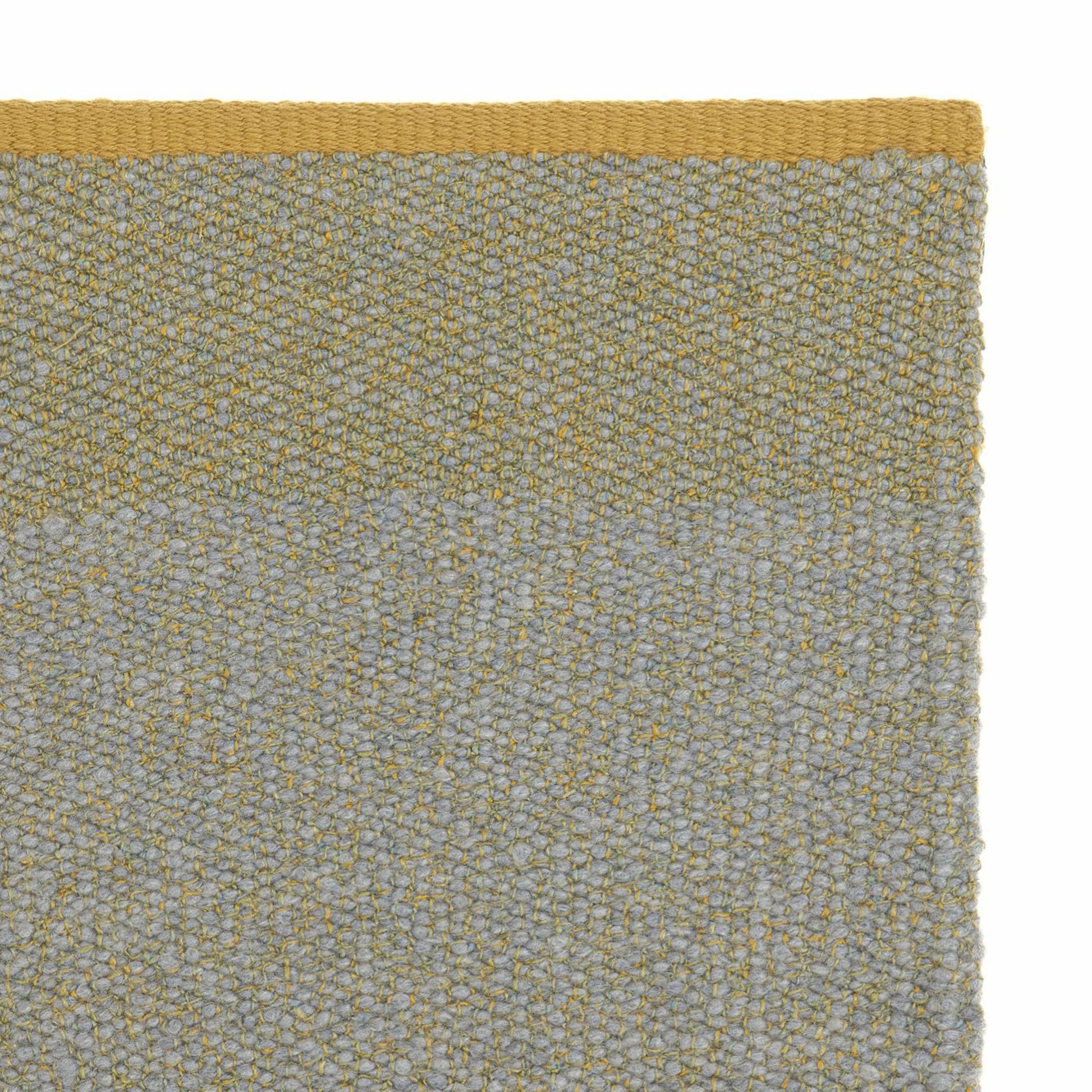 Pura rug style in pale grey and mustard colored twisted flat weave