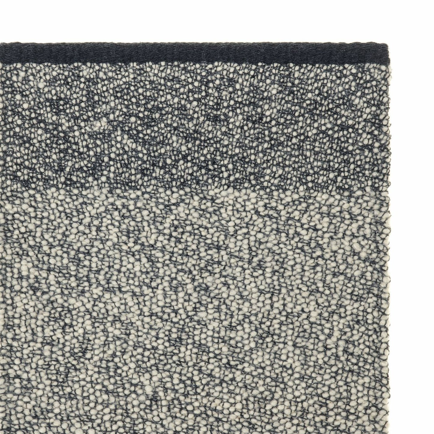 Pura rug style in black and buff colored twisted flat weave