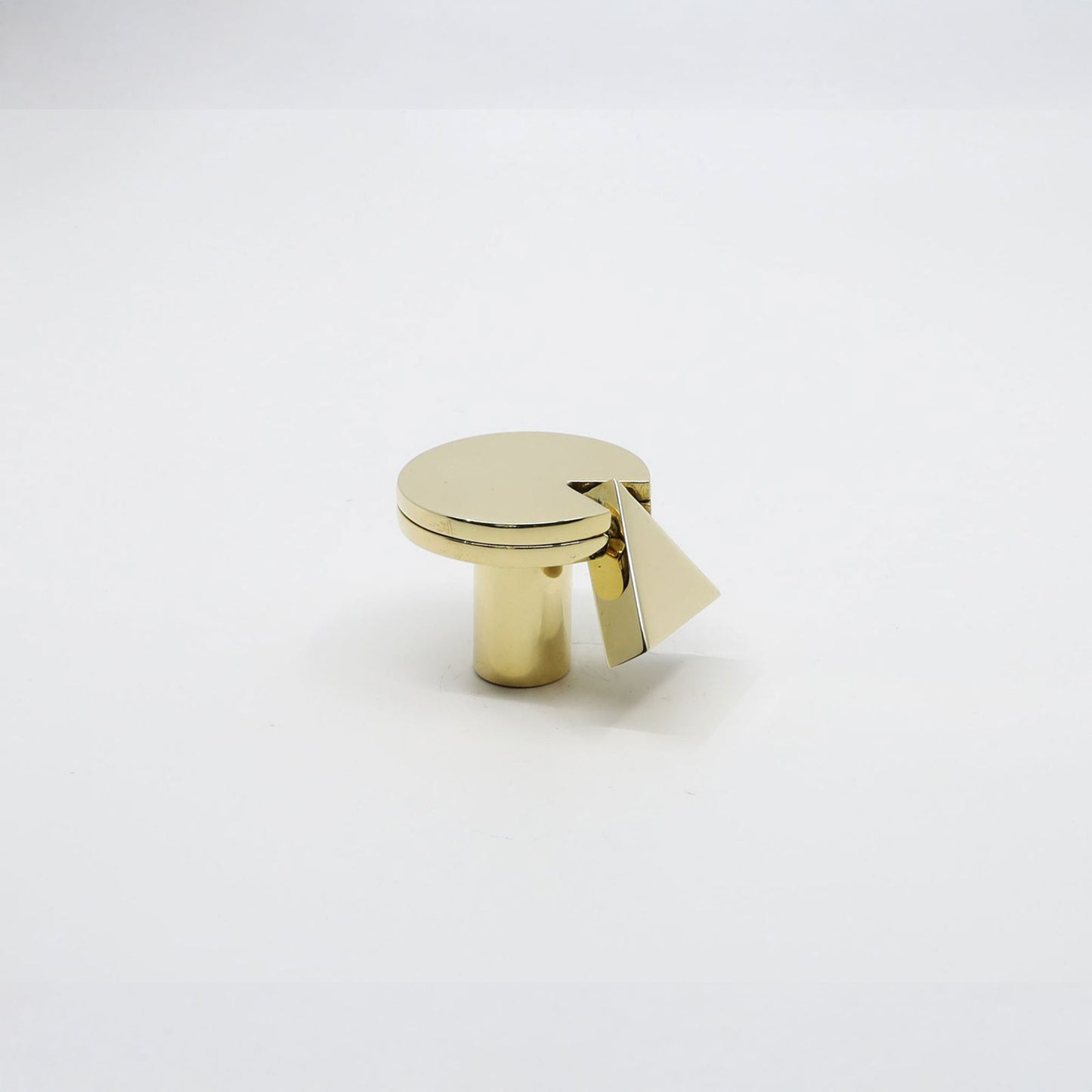 A polished gold cabinet knob with a circular top and a triangular pull handle, shown on a clean white background.