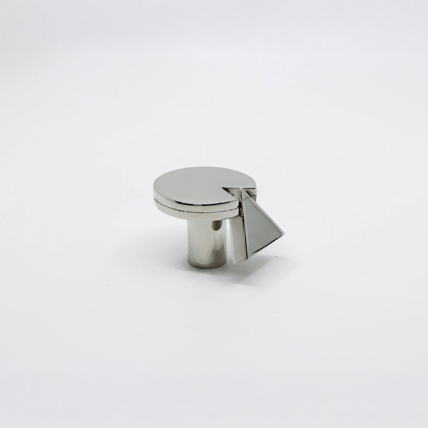 A modern cylindrical cabinet knob with a circular top and a geometric triangular accent, finished in a polished silver-tone metal.