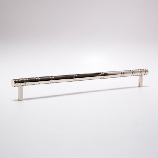 A polished silver metal cabinet pull handle with a textured, segmented grip design, shown on a clean white studio background.