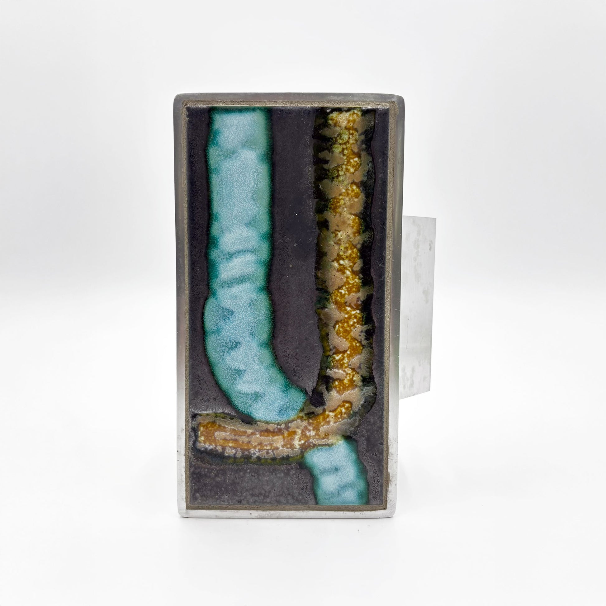 A rectangular silver-toned door handle with abstract turquoise and gold textured ceramic inlay on a dark background, shown against a plain white background.