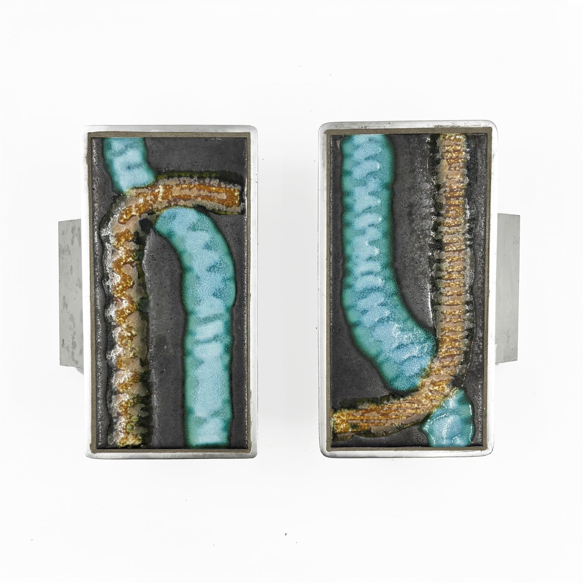 A pair of rectangular silver-toned door handles with abstract turquoise and gold textured inlay on a dark background, shown against a plain white background.