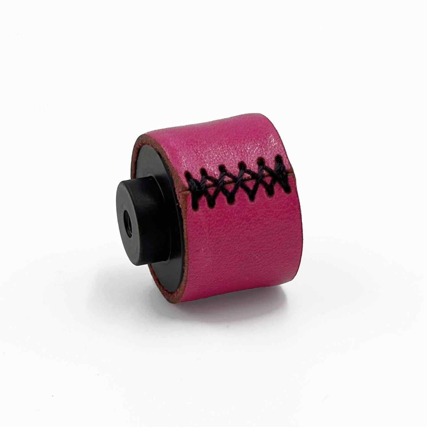A small cylindrical pink leather cabinet knobs with black stitching and a black standoff, photographed on a clean white background.