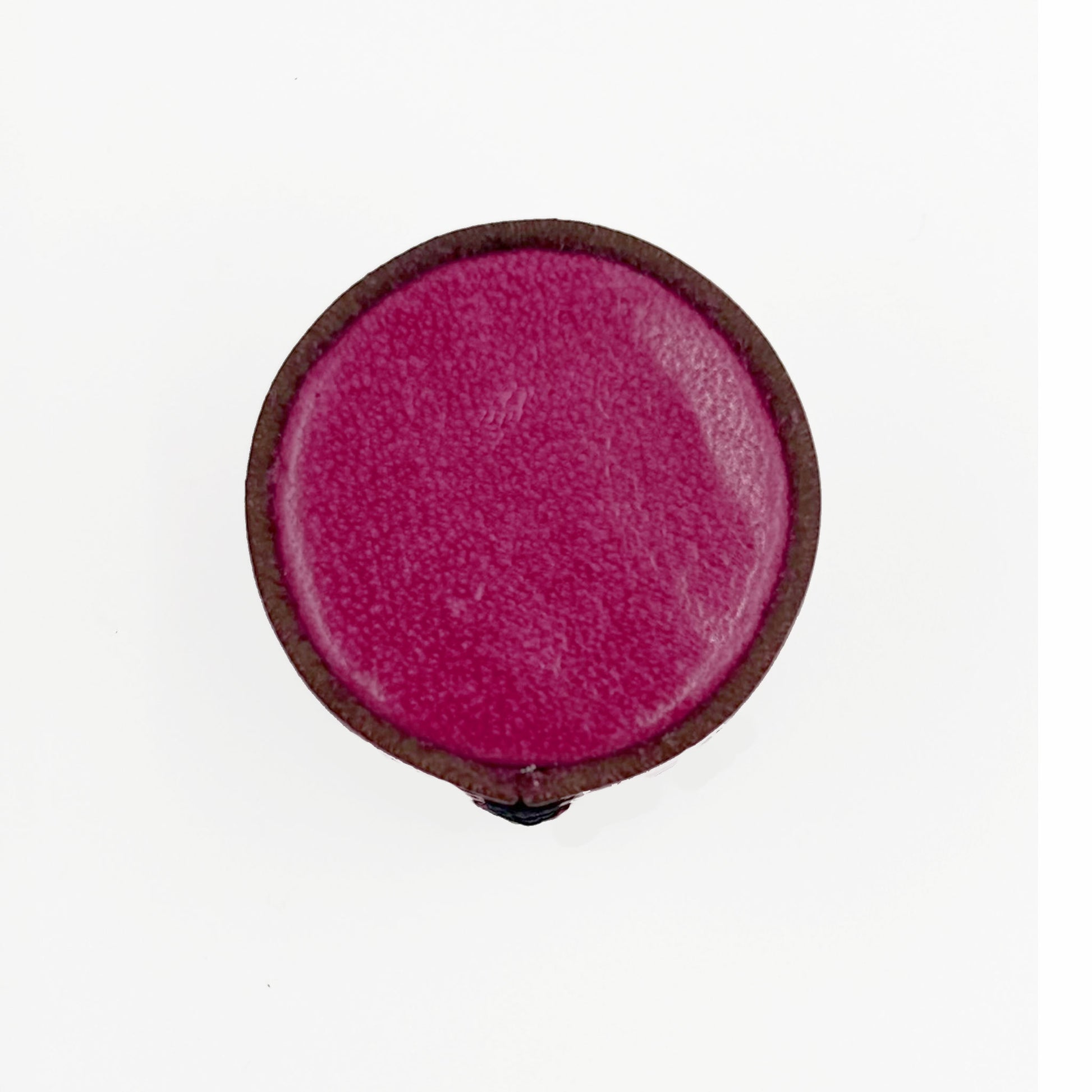 A single leather cabinet knob with a  magenta-pink center and a dark brown outer rim, shown against a plain white background.
