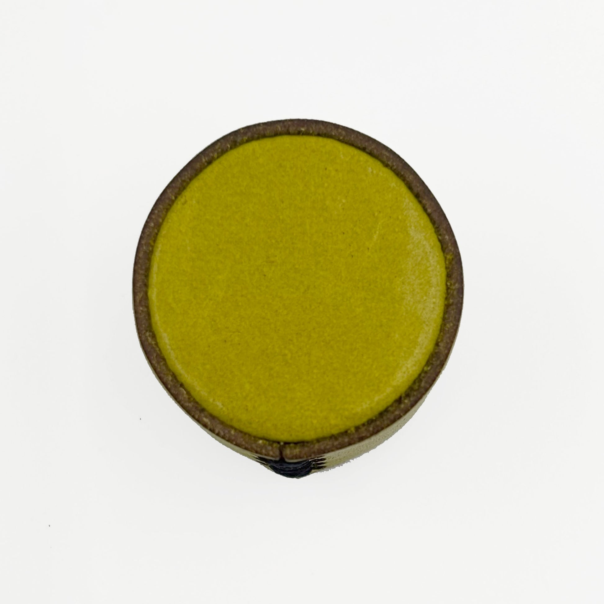 A circular top view of a leather cabinet knob in olive green interior, shown from a top-down view on a plain white background.