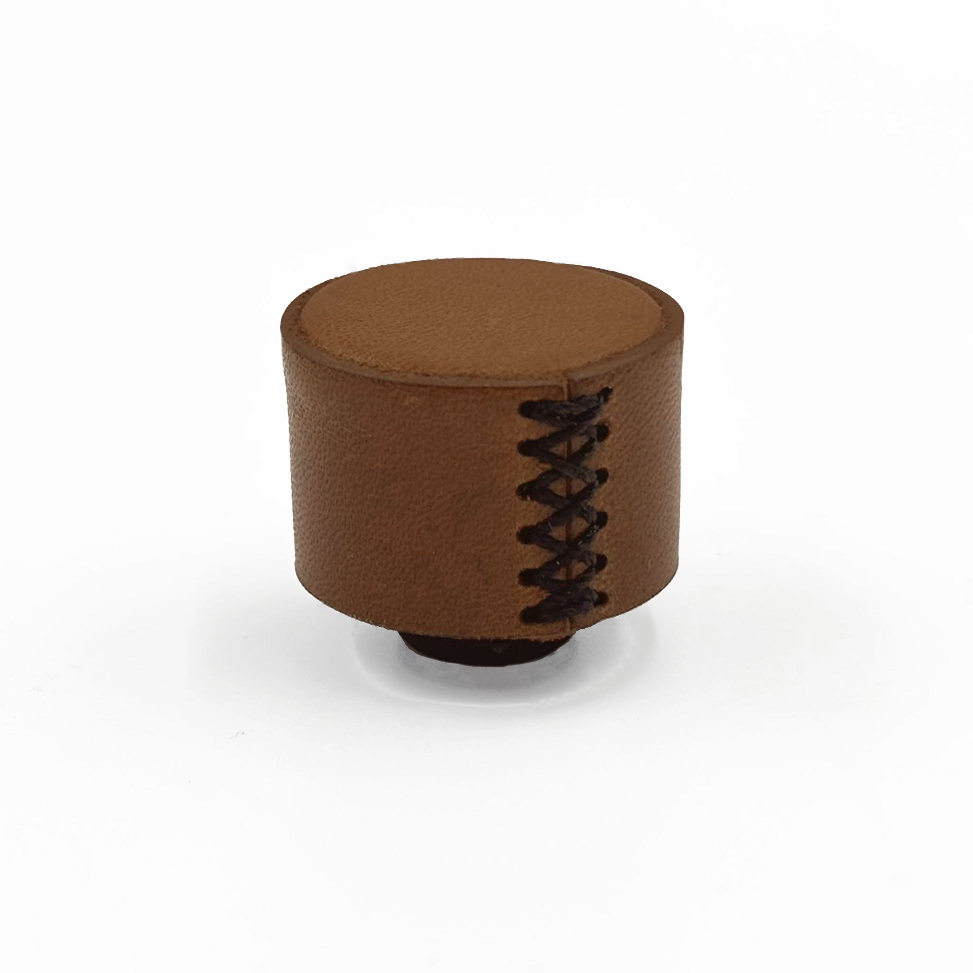A brown leather cabinet knob with decorative black lacing on the side, photographed on a clean white background.