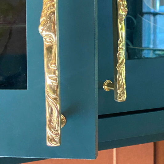 Half face shaped cabinet pull over gtwo cabinet doors