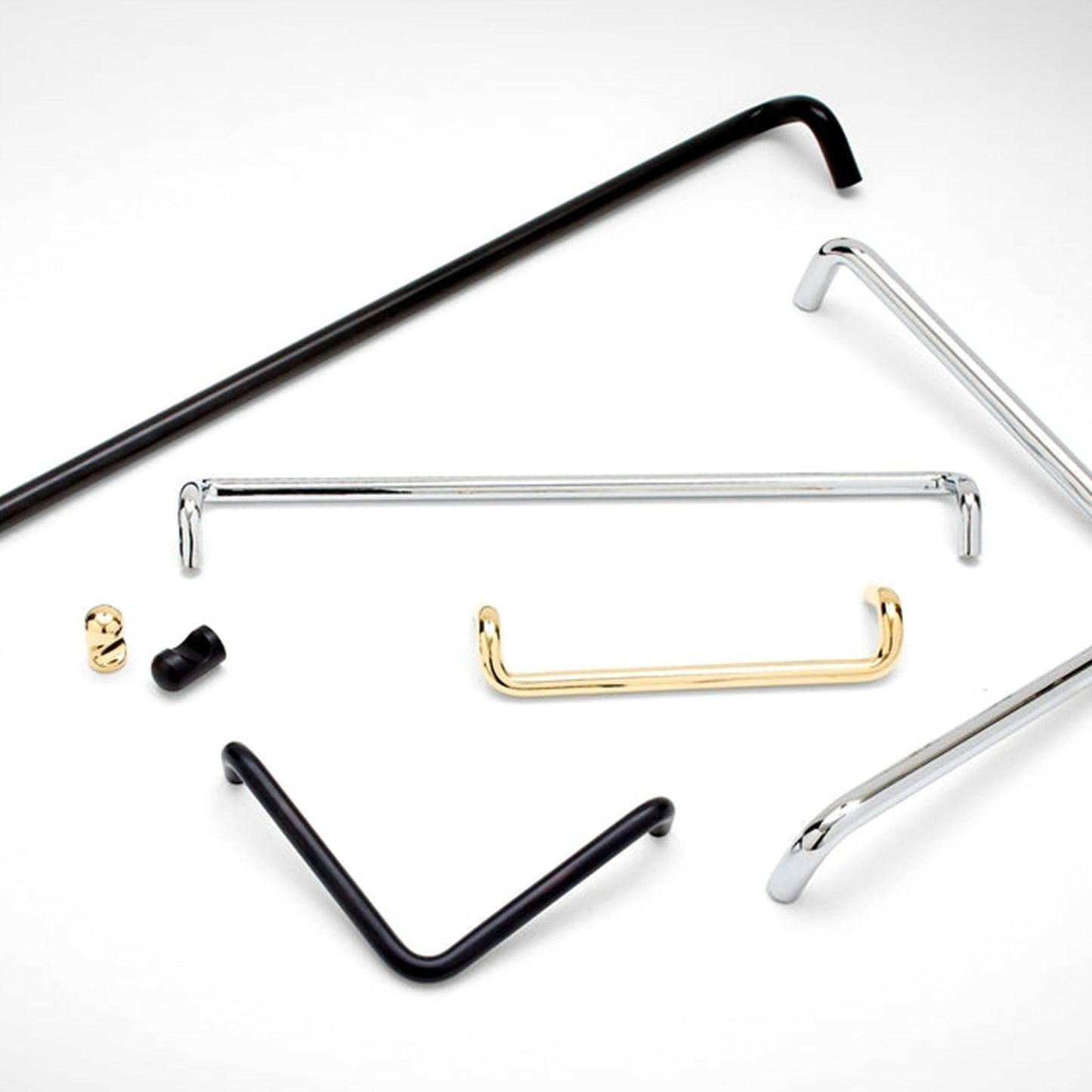 A set of metal cabinet knobs and pulls in black, polished silver, and gold finishes, arranged on a clean white background.