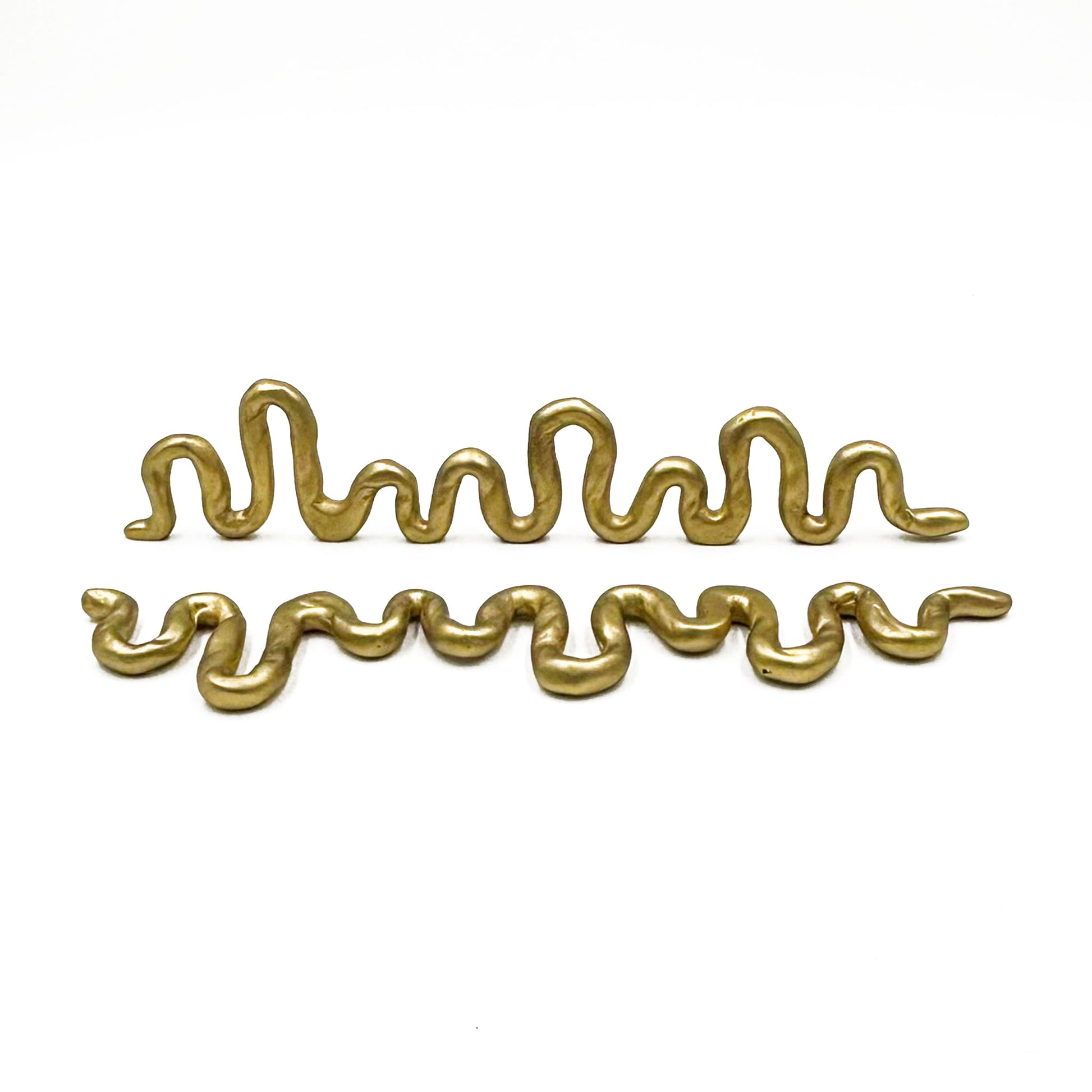 Two wavy, snake-like metallic gold cabinet pulls displayed horizontally on a clean white background.