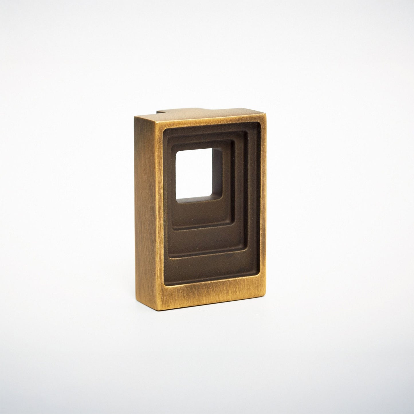 A rectangular brass cabinet pull handle with a recessed square cutout, shown on a clean white background.