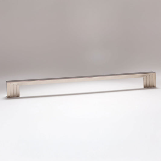 A long, rectangular cabinet pull handle with a brushed metallic finish, shown horizontally against a neutral gray background.