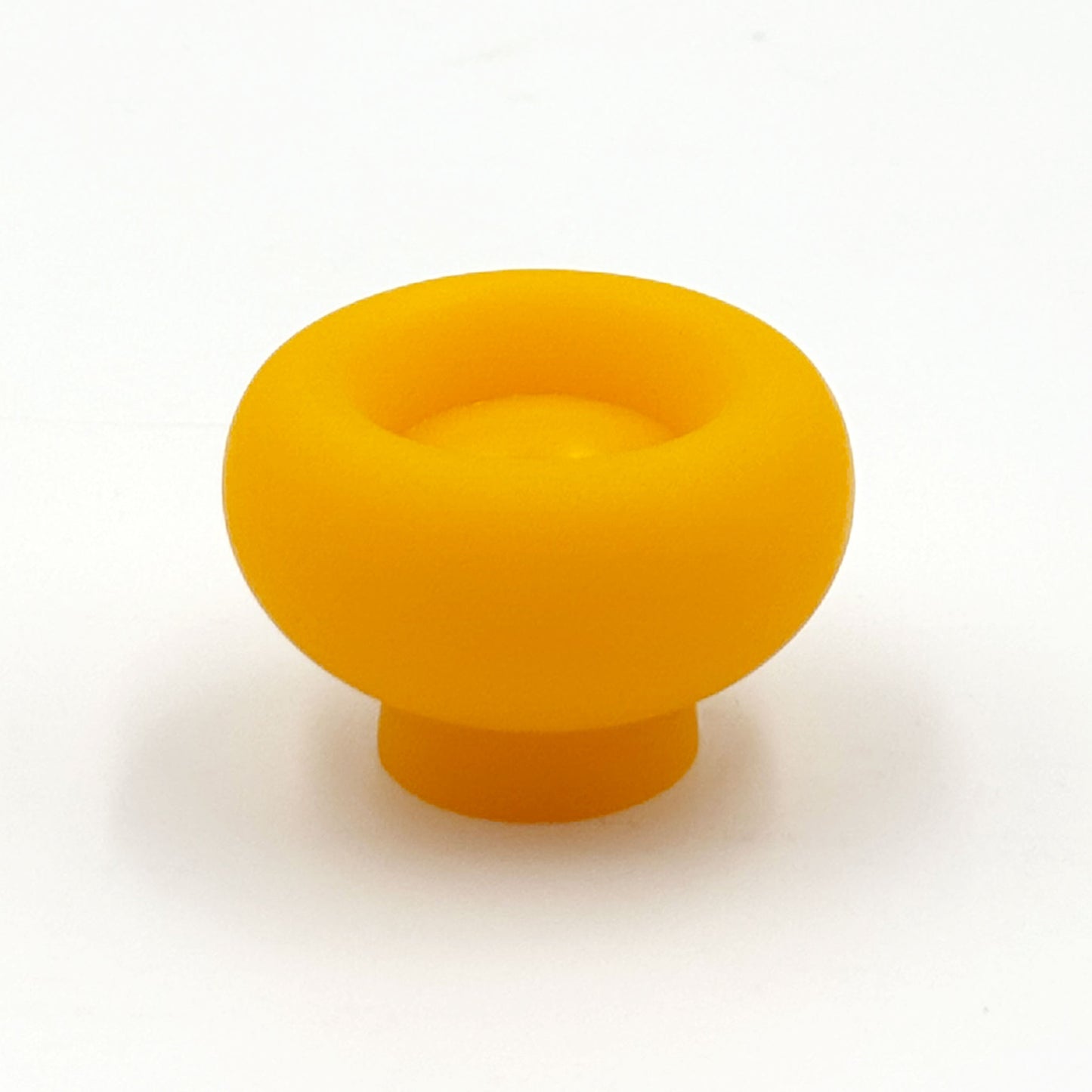 Chunky yellow colored cabinet knobs on a white background