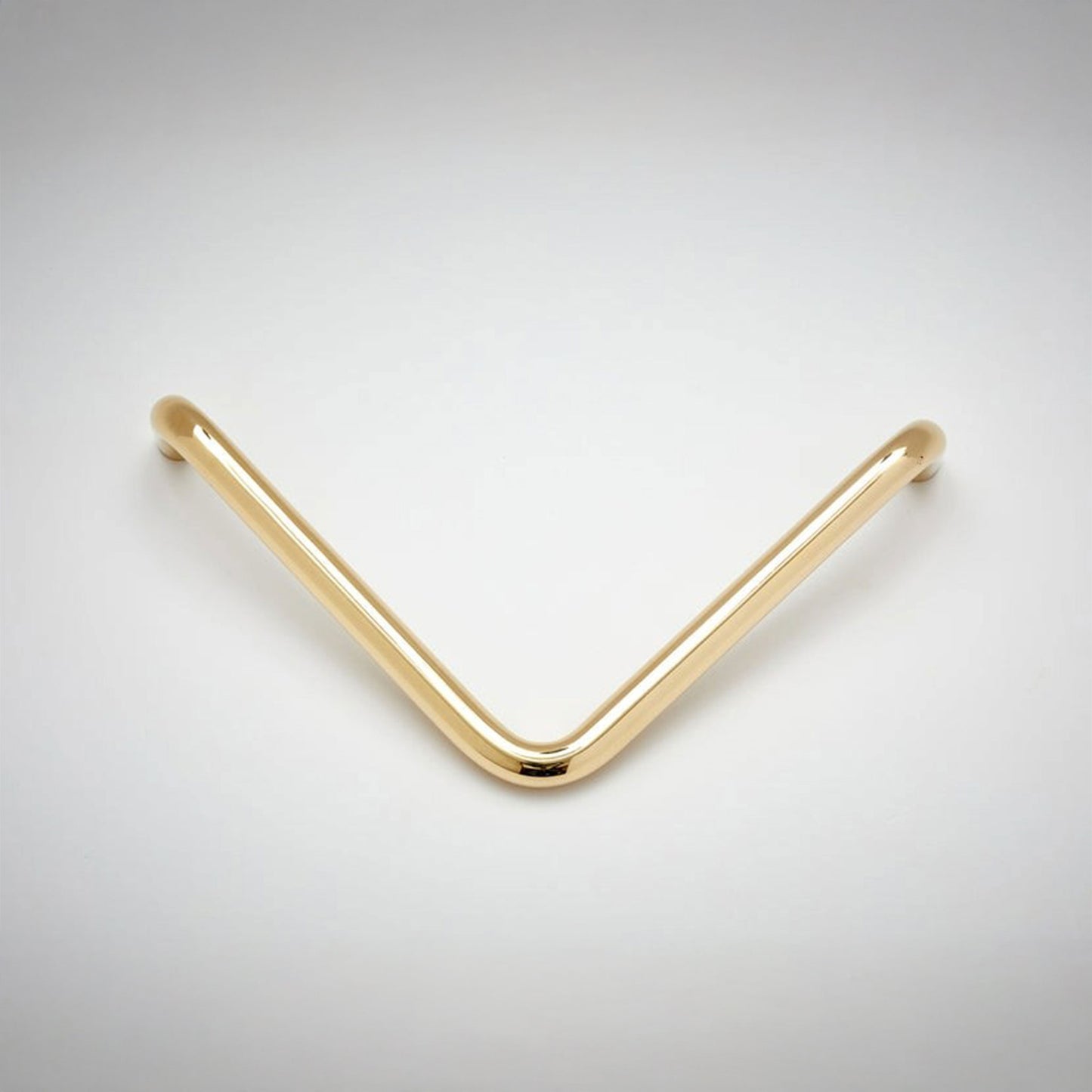 A tube metal L-shaped cabinet pull on a white background