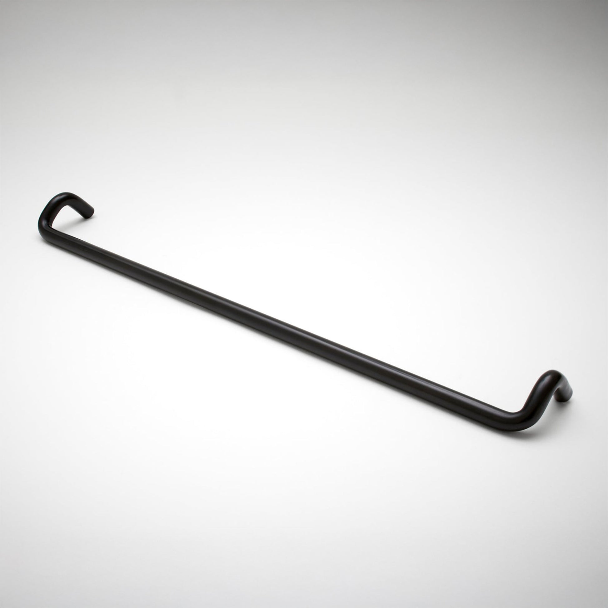 A cabinet pull with a sleek, curved design, shown diagonally on a light gray gradient background.