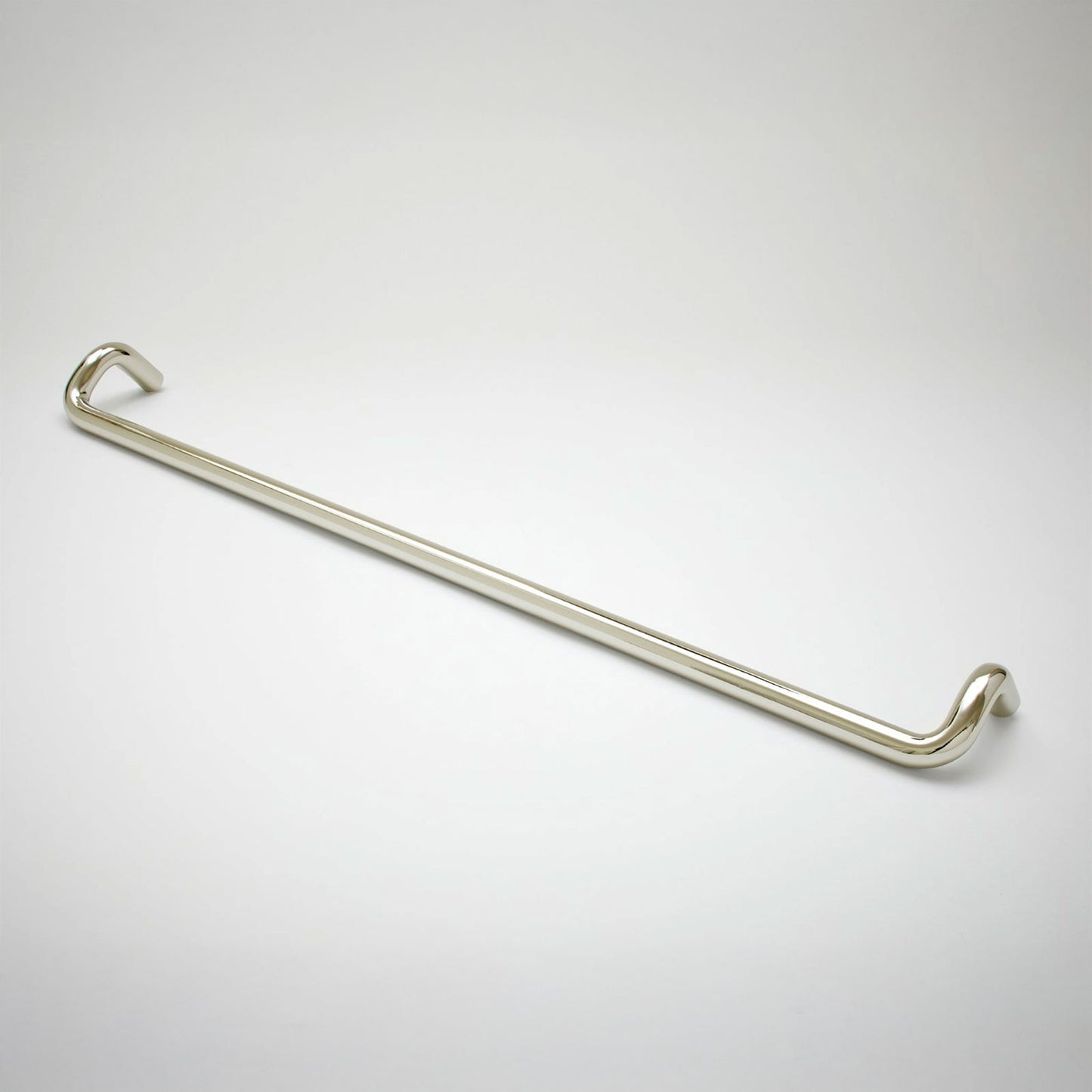 A polished cabinet pull with a sleek, curved design, shown diagonally on a light gray gradient background.