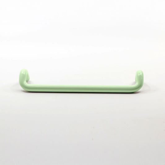 A single pale mint green metal cabinet pull  with a glossy finish, shown horizontally against a plain white background.