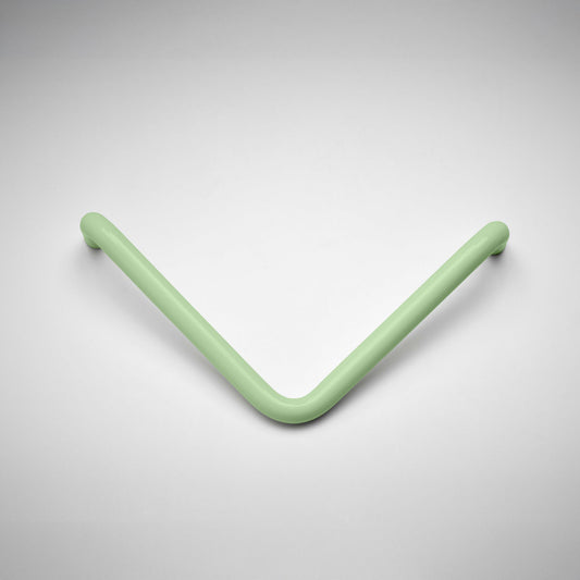 A minimalist V-shaped metal cabinet pull handle in a matte sage green finish, shown on a clean light gray gradient background.