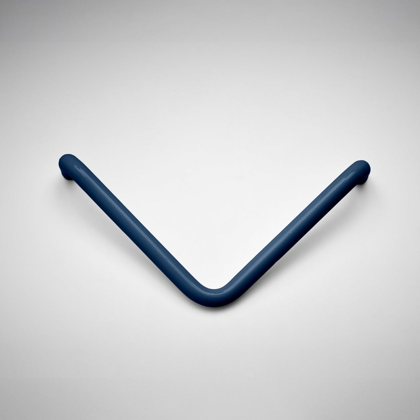 A dark blue V-shaped cabinet pull handle, likely for a door or drawer, shown on a clean light gray background.
