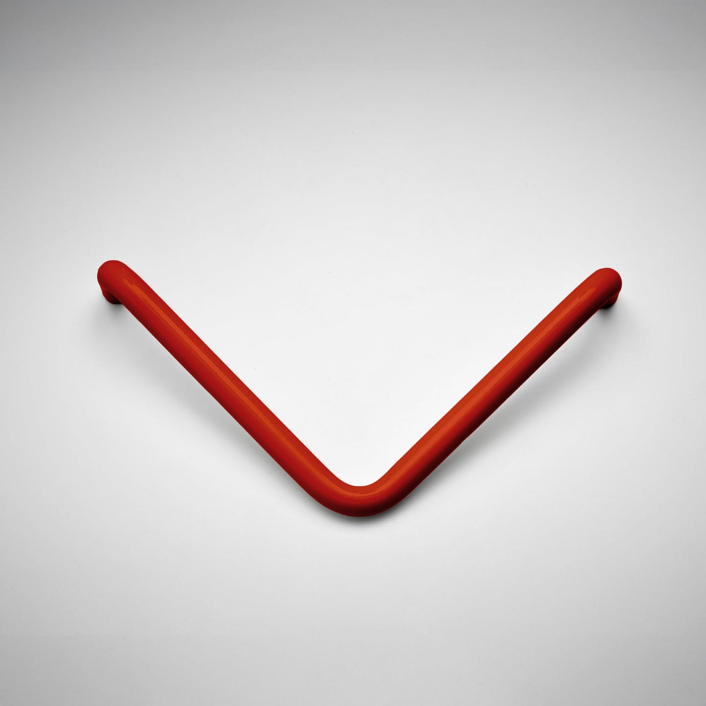 A curved, V-shaped metal cabinet pull in a matte red finish, displayed on a clean light gray background.