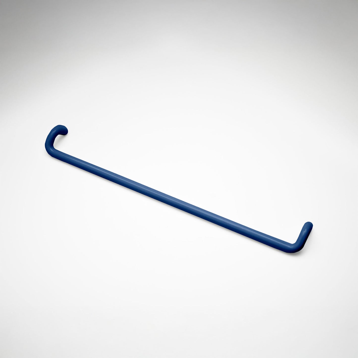 A minimalist navy metal cabinet pull with a curved, modern design, shown on a clean light gray background.